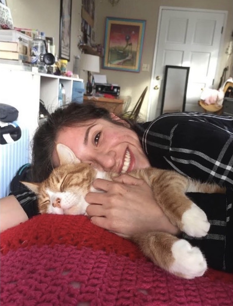 Kimberly Cuddling With an Orange Cat
