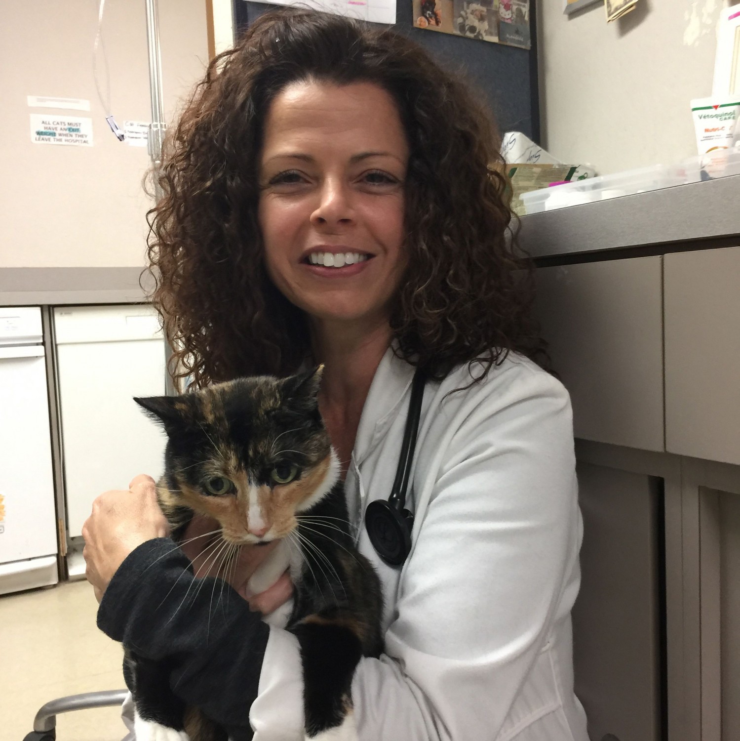 Dr. Claudine Gonzales Holding Calico Cat